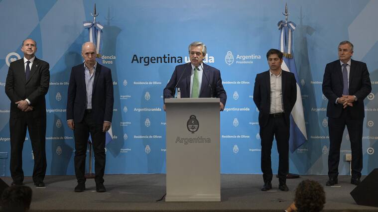 Argentine President Alberto Fernandez (C) talks next to Buenos Aires Mayor Horacio Rodriguez Larreta (2-L), Santa Fe's Governor Omar Perotti (L), Buenos Aires Governor Axel Kicillof (2-R), and Jujuy's Governor Gerardo Morales, in a press conference announcing measures during the outbreak of the new Coronavirus, COVID-19, at Presidential residence in Olivos, Buenos Aires on March 19, 2020. - Argentine President Alberto Fernandez on Thursday announced a "preventative and compulsory" lockdown of the population from Friday to March 31 to stop the spread of the coronavirus pandemic. (Photo by JUAN MABROMATA / AFP) (Photo by JUAN MABROMATA/AFP via Getty Images)