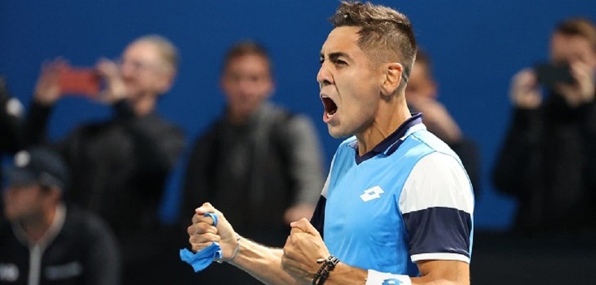 Chile's Alejandro Tabilo celebrates after victory against Colombia's Daniel Elahi Galan during their men's singles match on day two of the Australian Open tennis tournament in Melbourne on January 21, 2020. (Photo by DAVID GRAY / AFP) / IMAGE RESTRICTED TO EDITORIAL USE - STRICTLY NO COMMERCIAL USE