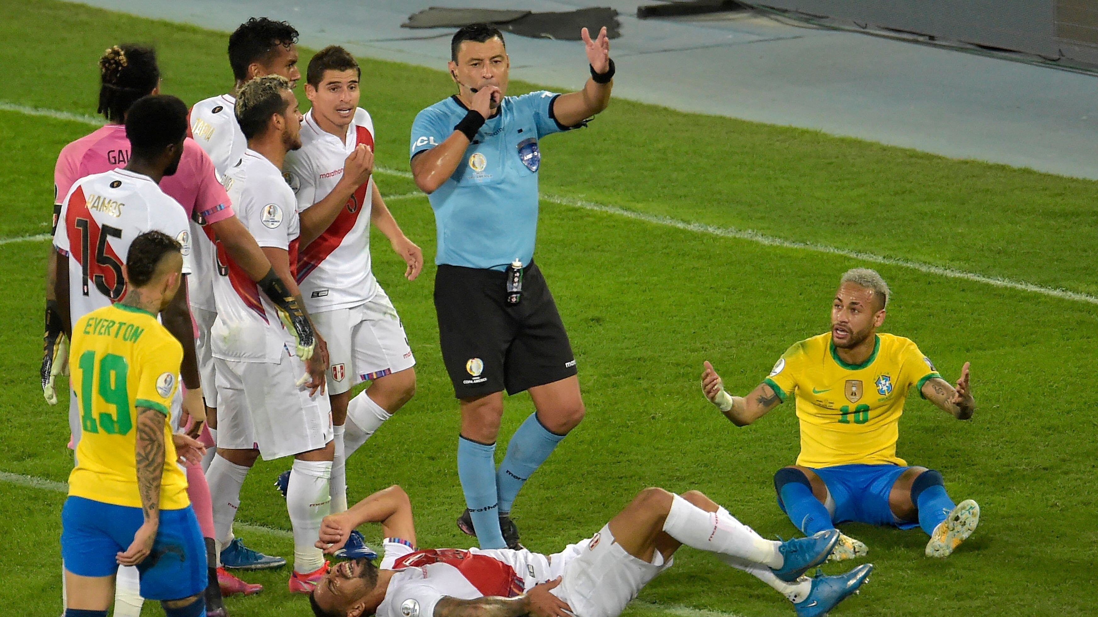 Chilean referee Roberto Tobar gestures during the Conmebol 2021 Copa America football tournament semi-final match between Brazil and Peru at the Nilton Santos Stadium in Rio de Janeiro, Brazil, on July 5, 2021. (Photo by Douglas Magno / AFP) (Photo by DOUGLAS MAGNO/AFP via Getty Images)