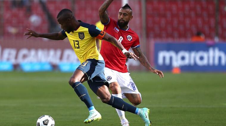 QUITO, ECUADOR - SEPTEMBER 05: Enner Valencia of Ecuador competes for the ball with Arturo Vidal of Chile during a match between Ecuador and Chile as part of South American Qualifiers for Qatar 2022 at Rodrigo Paz Delgado Stadium on September 05, 2021 in Quito, Ecuador. (Photo by José Jacomé - Pool/Getty Images)