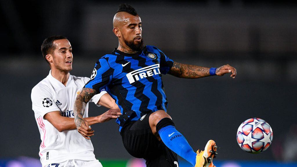 ESTADIO ALFREDO DI STEFANO, MADRID, SPAIN - 2020/11/03: Arturo Vidal (R) of FC Internazionale is challenged by Lucas Vazquez of Real Madrid CF during the Champions League Group B football match between Real Madrid CF and FC Internazionale. Real Madrid CF won 3-2 over FC Internazionale. (Photo by Nicolò Campo/LightRocket via Getty Images)
