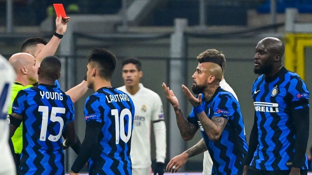 English referee Anthony Taylor (L) shows a red card to Inter Milan's Chilean midfielder Arturo Vidal (2ndR) during the UEFA Champions League Group B football match Inter Milan vs Real Madrid on November 25, 2020 at the Giuseppe-Meazza (San Siro) stadium in Milan. (Photo by MIGUEL MEDINA / AFP) (Photo by MIGUEL MEDINA/AFP via Getty Images)