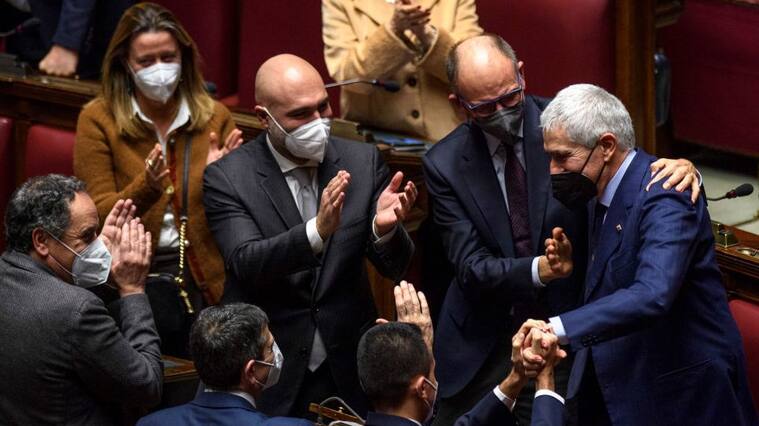 ROME, ITALY - JANUARY 29: Enrico Letta, Italian Senator Pier Ferdinando Casini and members of the Italian Parliament stand to applaud Sergio Mattarella after a quorum was reached during the sixth voting day for the election of the new Italian President, at the Chamber of Deputies, on January 29, 2022 in Rome, Italy. Sergio Mattarella was re-elected as Italian president. (Photo by Antonio Masiello/Getty Images)