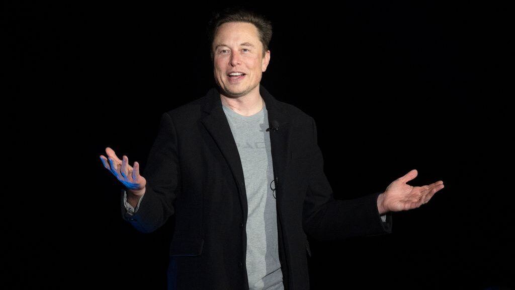 Elon Musk gestures as he speaks during a press conference at SpaceX's Starbase facility near Boca Chica Village in South Texas on February 10, 2022. - Billionaire entrepreneur Elon Musk delivered an eagerly-awaited update on SpaceX's Starship, a prototype rocket the company is developing for crewed interplanetary exploration. (Photo by JIM WATSON / AFP) (Photo by JIM WATSON/AFP via Getty Images)