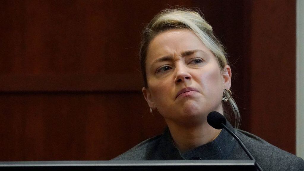 US actress Amber Heard testifies in the courtroom at the Fairfax County Circuit Courthouse in Fairfax, Virginia, on May 16, 2022. - Actor Johnny Depp sued his ex-wife Amber Heard for libel in Fairfax County Circuit Court after she wrote an op-ed piece in The Washington Post in 2018 referring to herself as a "public figure representing domestic abuse." (Photo by Steve Helber / POOL / AFP) (Photo by STEVE HELBER/POOL/AFP via Getty Images)