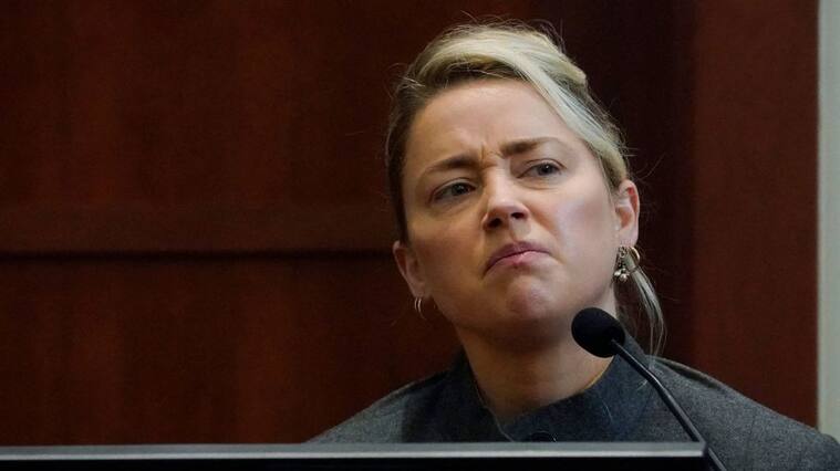 US actress Amber Heard testifies in the courtroom at the Fairfax County Circuit Courthouse in Fairfax, Virginia, on May 16, 2022. - Actor Johnny Depp sued his ex-wife Amber Heard for libel in Fairfax County Circuit Court after she wrote an op-ed piece in The Washington Post in 2018 referring to herself as a "public figure representing domestic abuse." (Photo by Steve Helber / POOL / AFP) (Photo by STEVE HELBER/POOL/AFP via Getty Images)