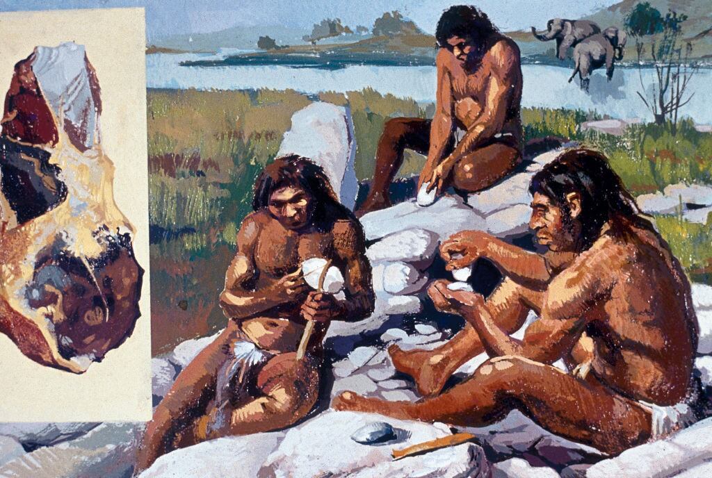 Neanderthals making weapons and tools. (Photo by Prisma/UIG/Getty Images)