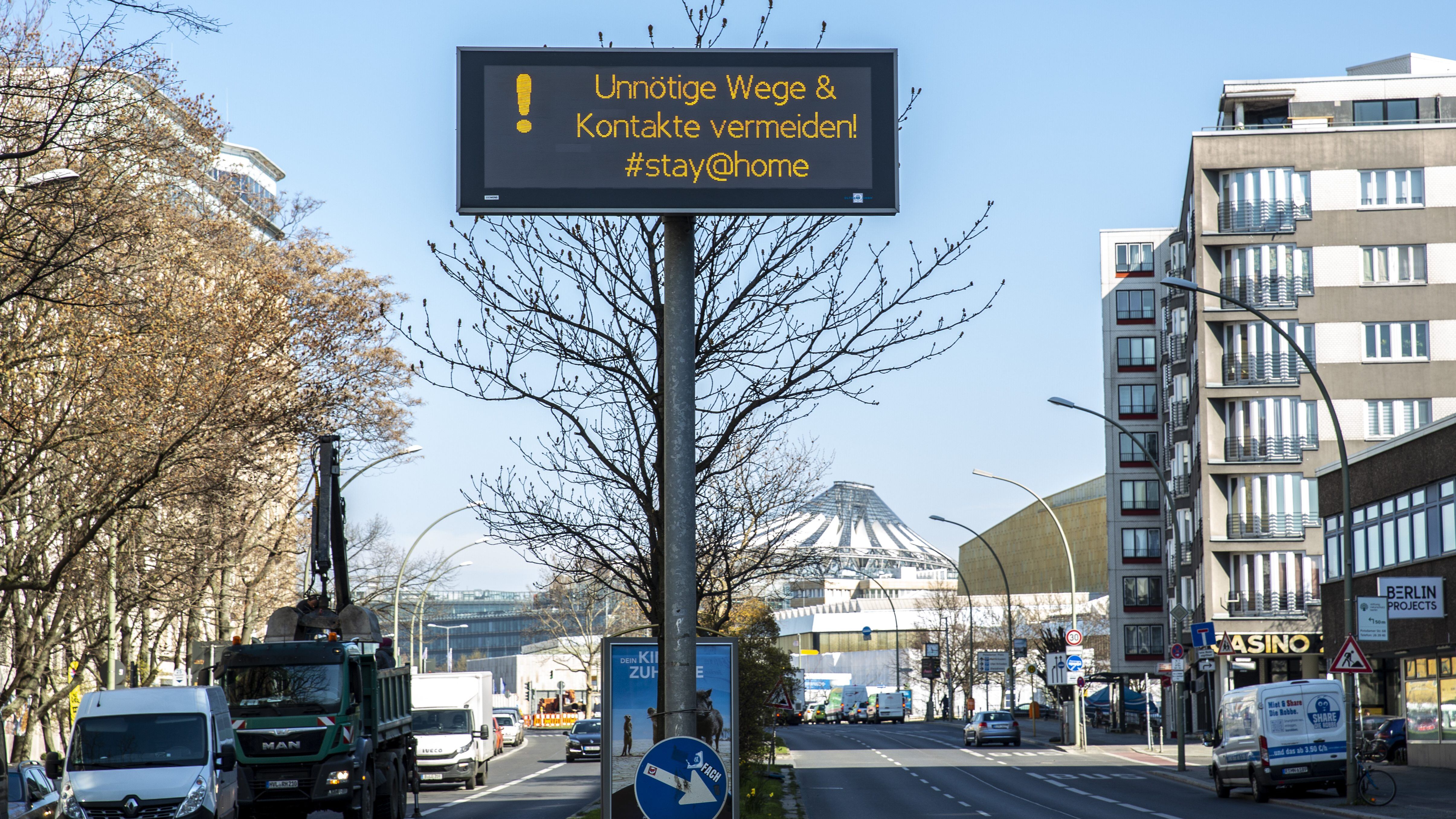 BERLIN, GERMANY - MARCH 24: "Avoid unnecessary roads and contacts, #stay@home" says a sign on March 24, 2020 in Berlin, Germany. The coronavirus and the disease it causes, COVID-19, are having a fundamental impact on society, government and the economy in Germany. Public life has been restricted to the essentials in an effort to slow the spread of infection. Hospitals are scrambling to increase their testing and care capacity. A recession seems likely as economic activity is slowed and many businesses are temporarily closed. Schools, daycare centers and universities remain shuttered. Both federal and state government seek to mobilize resources and find adequate policies to confront the virus and mitigate its impact. (Photo by Maja Hitij/Getty Images)