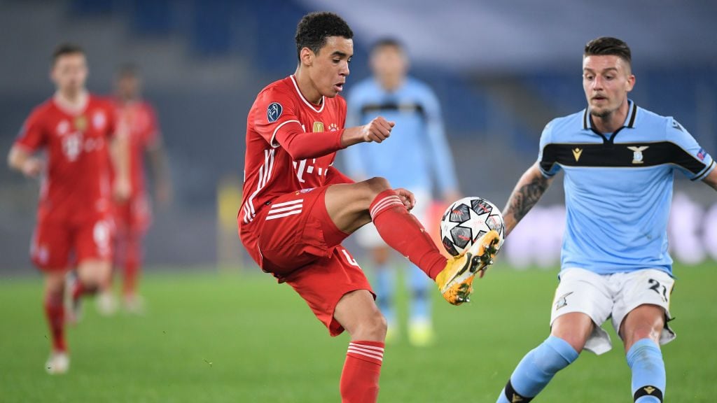 23 February 2021, Italy, Rom: Football: Champions League, Lazio Roma - FC Bayern München, knockout round, round of 16, first leg at Stadio Olimpico di Roma. Munich's Jamal Musiala and Lazio's Sergej Milinkovic-Savic (r) in action. Photo: Giuseppe Maffia/dpa (Photo by Giuseppe Maffia/picture alliance via Getty Images)
