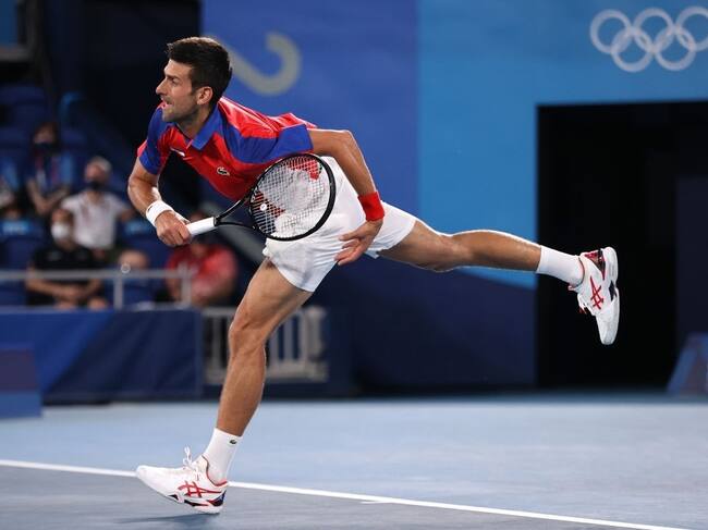 TOKYO, JAPAN - JULY 29: Novak Djokovic of Team Serbia serves during his Men's Singles Quarterfinal match against Kei Nishikori of Team Japan on day six of the Tokyo 2020 Olympic Games at Ariake Tennis Park on July 29, 2021 in Tokyo, Japan. (Photo by Clive Brunskill/Getty Images)