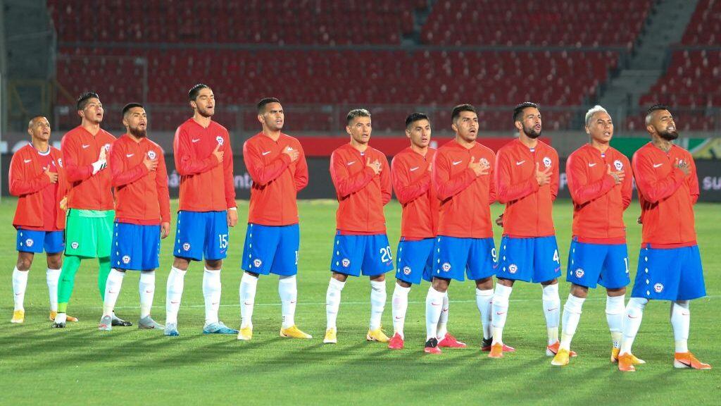 Chile's players sing the national anthem before the start of the 2022 FIFA World Cup South American qualifier football match between Chile and Colombia at the National Stadium in Santiago, on October 13, 2020, amid the COVID-19 novel coronavirus pandemic. (Photo by Esteban Felix / POOL / AFP) (Photo by ESTEBAN FELIX/POOL/AFP via Getty Images)