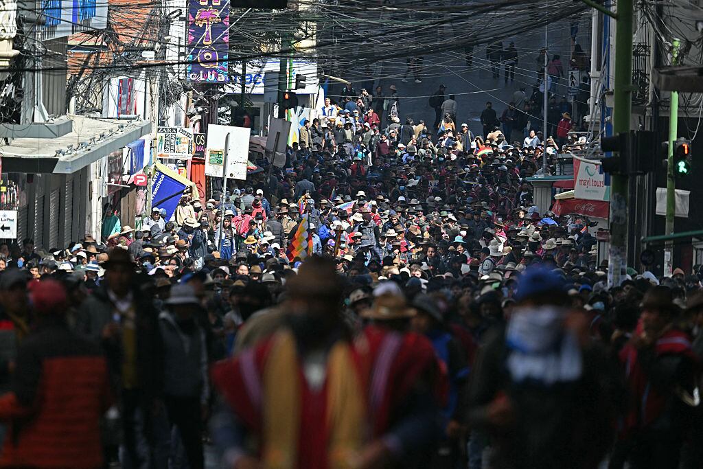 People protest in demand of the resignation of Bolivia's President Rodrigo Paz in La Paz, on May 18, 2026. Bolivians have taken to the streets for the past two weeks, blocking roads into La Paz and disrupting deliveries of food, medicine and other goods to the seat of government, while demanding higher wages, economic relief and the resignation of centre-right President Rodrigo Paz amid a severe economic crisis (Photo by AIZAR RALDES / AFP via Getty Images)