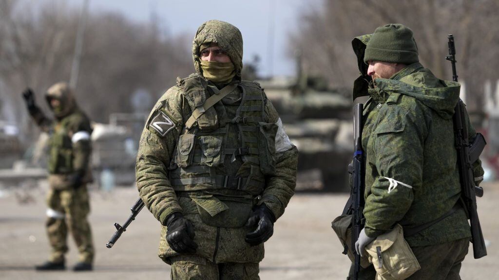 MARIUPOL, UKRAINE - MARCH 20: Security forces are seen as civilians trapped in Mariupol city under Russian attacks, are evacuated in groups under the control of pro-Russian separatists, through other cities, in Mariupol, Ukraine on March 20, 2022. (Photo by Stringer/Anadolu Agency via Getty Images)
