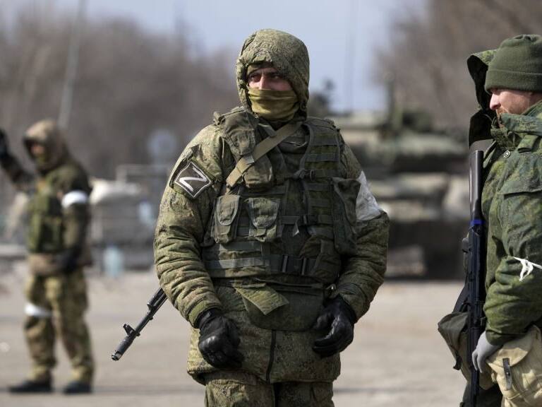 MARIUPOL, UKRAINE - MARCH 20: Security forces are seen as civilians trapped in Mariupol city under Russian attacks, are evacuated in groups under the control of pro-Russian separatists, through other cities, in Mariupol, Ukraine on March 20, 2022. (Photo by Stringer/Anadolu Agency via Getty Images)