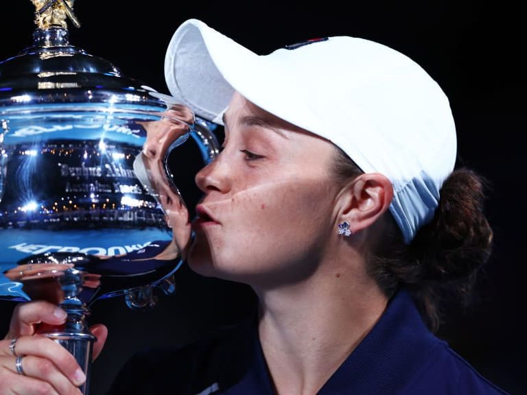 MELBOURNE, AUSTRALIA - JANUARY 29: Ashleigh Barty of Australia kisses the Daphne Akhurst Memorial Cup after winning her Women’s Singles Final match against Danielle Collins of United States during day thirteen of the 2022 Australian Open at Melbourne Park on January 29, 2022 in Melbourne, Australia. (Photo by Clive Brunskill/Getty Images)