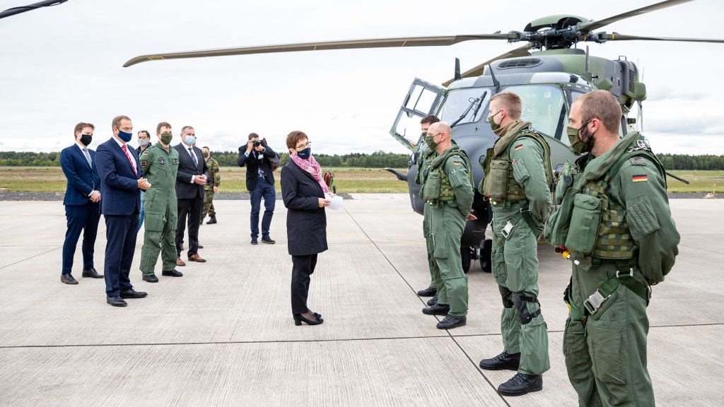 25 September 2020, Lower Saxony, Faßberg: Annegret Kramp-Karrenbauer (CDU, M), Minister of Defence, is having the technology of the transport helicopter "NH90" explained to her during her visit to the Faßberg airbase in the administrative district of Celle. Among other things, the visit is about the upcoming Afghanistan mission of the army planes. Photo: Moritz Frankenberg/dpa (Photo by Moritz Frankenberg/picture alliance via Getty Images)