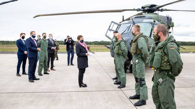 25 September 2020, Lower Saxony, Faßberg: Annegret Kramp-Karrenbauer (CDU, M), Minister of Defence, is having the technology of the transport helicopter "NH90" explained to her during her visit to the Faßberg airbase in the administrative district of Celle. Among other things, the visit is about the upcoming Afghanistan mission of the army planes. Photo: Moritz Frankenberg/dpa (Photo by Moritz Frankenberg/picture alliance via Getty Images)