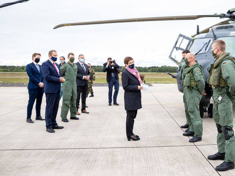 25 September 2020, Lower Saxony, Faßberg: Annegret Kramp-Karrenbauer (CDU, M), Minister of Defence, is having the technology of the transport helicopter "NH90" explained to her during her visit to the Faßberg airbase in the administrative district of Celle. Among other things, the visit is about the upcoming Afghanistan mission of the army planes. Photo: Moritz Frankenberg/dpa (Photo by Moritz Frankenberg/picture alliance via Getty Images)
