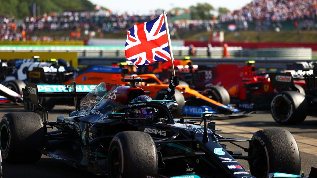 NORTHAMPTON, ENGLAND - JULY 18: Race winner Lewis Hamilton of Great Britain and Mercedes GP celebrates in parc ferme during the F1 Grand Prix of Great Britain at Silverstone on July 18, 2021 in Northampton, England. (Photo by Dan Istitene - Formula 1/Formula 1 via Getty Images)