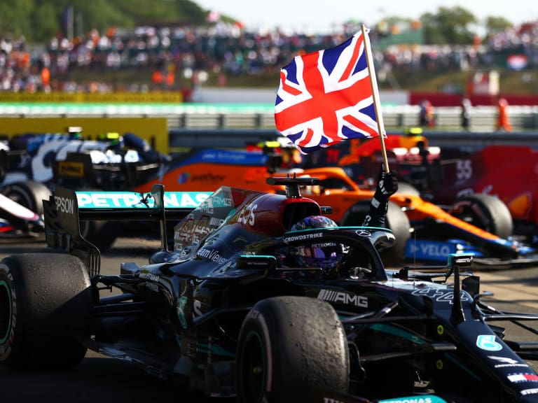 NORTHAMPTON, ENGLAND - JULY 18: Race winner Lewis Hamilton of Great Britain and Mercedes GP celebrates in parc ferme during the F1 Grand Prix of Great Britain at Silverstone on July 18, 2021 in Northampton, England. (Photo by Dan Istitene - Formula 1/Formula 1 via Getty Images)