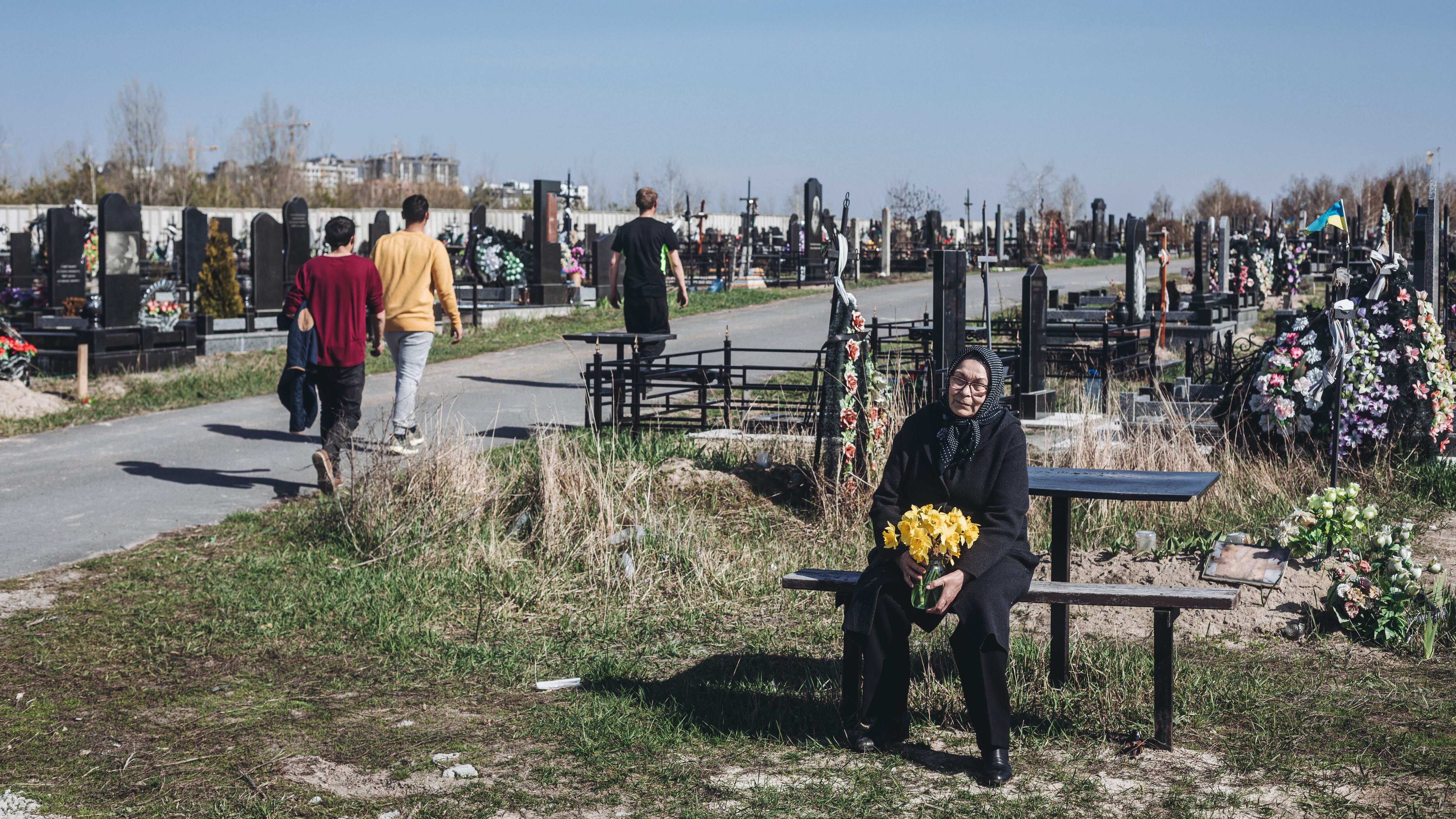 BUCHA, UKRAINE - APRIL 15: A relative of a Ukrainian war victim mourns during the funeral of her family member killed due to the ongoing Russian attacks in Bucha, Ukraine on April 15, 2022. (Photo by Diego Herrera Carcedo/Anadolu Agency via Getty Images)