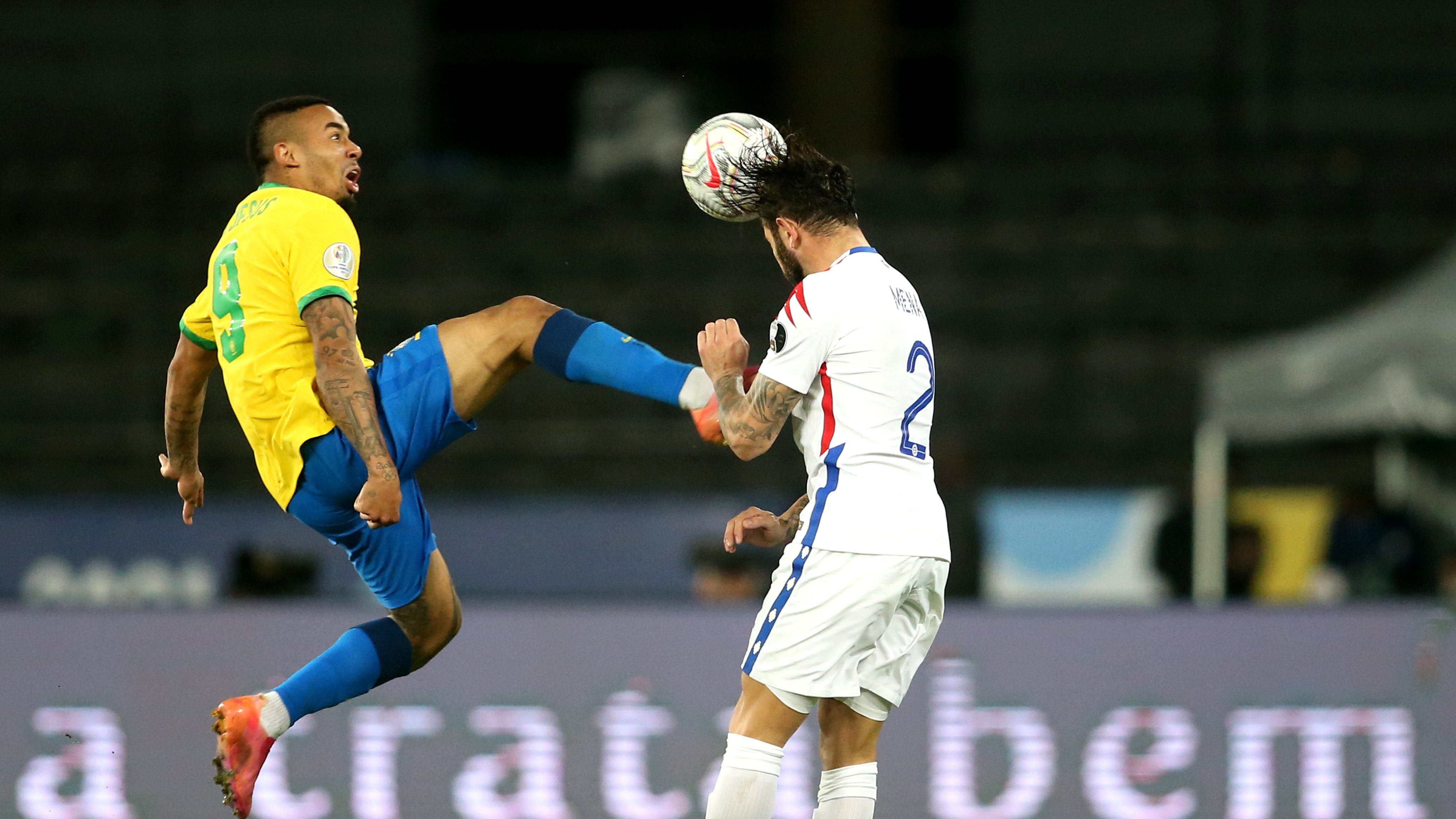 RIO DE JANEIRO, BRAZIL - JULY 02: Gabriel Jesus of Brazil competes for the ball with Eugenio Mena of Chile ,during the Quarterfinal match between Brazil and Chile as part of Conmebol Copa America Brazil 2021 at Estadio Olímpico Nilton Santos on July 2, 2021 in Rio de Janeiro, Brazil. (Photo by MB Media/Getty Images)