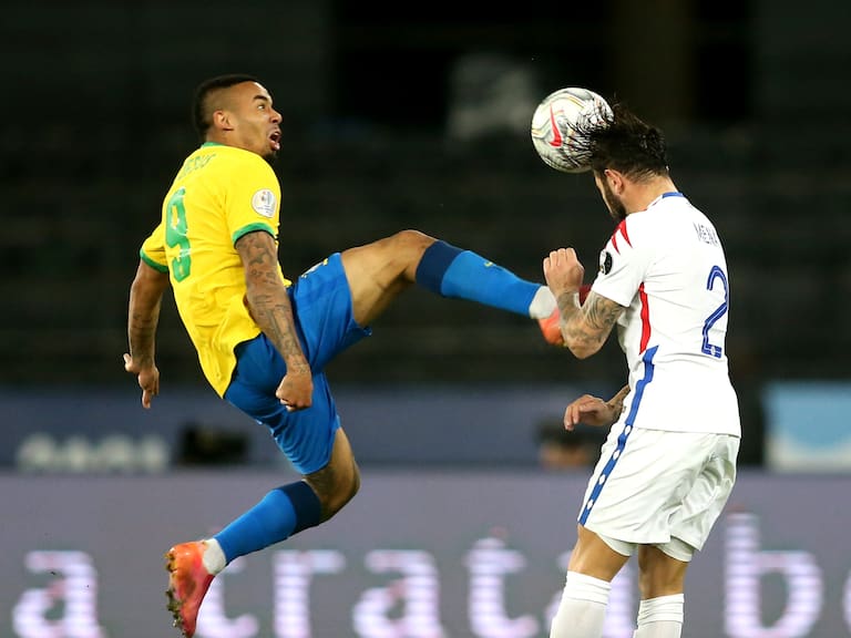 RIO DE JANEIRO, BRAZIL - JULY 02: Gabriel Jesus of Brazil competes for the ball with Eugenio Mena of Chile ,during the Quarterfinal match between Brazil and Chile as part of Conmebol Copa America Brazil 2021 at Estadio Olímpico Nilton Santos on July 2, 2021 in Rio de Janeiro, Brazil. (Photo by MB Media/Getty Images)