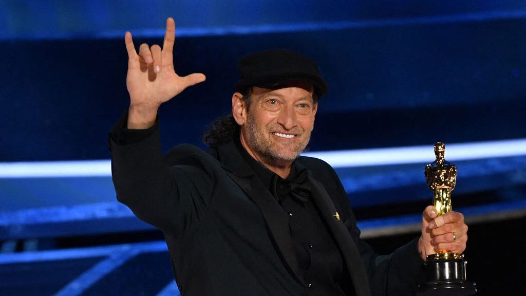 US actor Troy Kotsur accepts the award for Best Actor in a Supporting Role for "CODA" onstage during the 94th Oscars at the Dolby Theatre in Hollywood, California on March 27, 2022. (Photo by Robyn Beck / AFP) (Photo by ROBYN BECK/AFP via Getty Images)