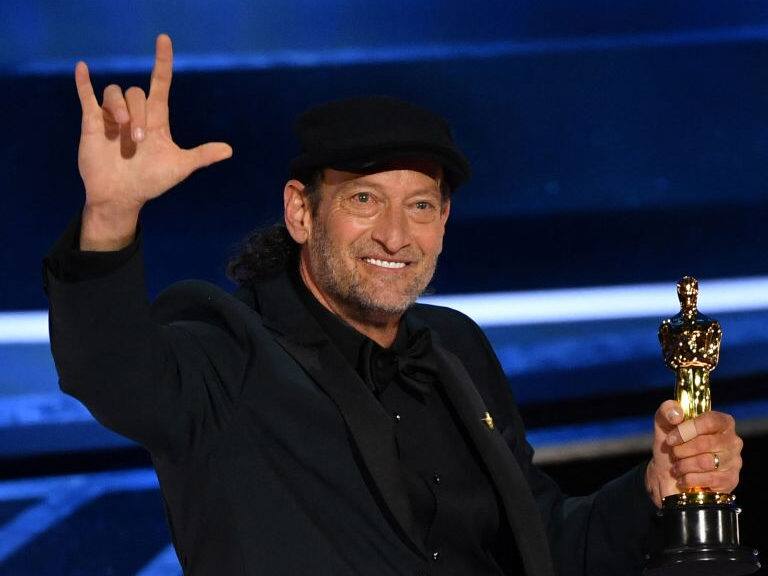 US actor Troy Kotsur accepts the award for Best Actor in a Supporting Role for "CODA" onstage during the 94th Oscars at the Dolby Theatre in Hollywood, California on March 27, 2022. (Photo by Robyn Beck / AFP) (Photo by ROBYN BECK/AFP via Getty Images)