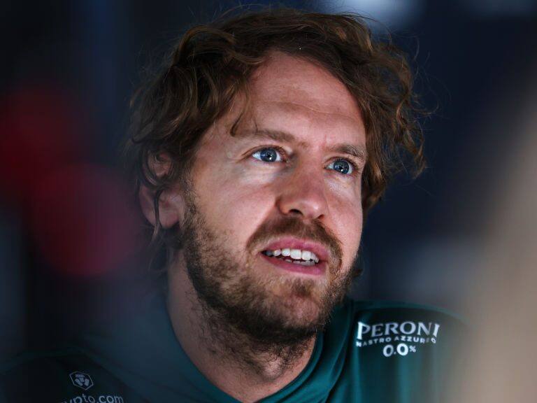 SPIELBERG, AUSTRIA - JULY 07: Sebastian Vettel of Germany and Aston Martin F1 Team talks to the media in the Paddock during previews ahead of the F1 Grand Prix of Austria at Red Bull Ring on July 07, 2022 in Spielberg, Austria. (Photo by Bryn Lennon/Getty Images)