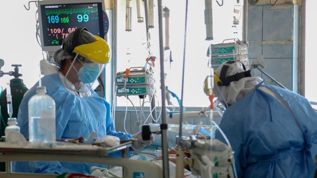Health personnel care for children infected with COVID-19 at the Intensive Care ward of the Felipe Urriola Hospital in Iquitos, Peru on July 8, 2020. - Among the patients with COVID-19 in Peru are 24 children in the hospital in Iquitos, the largest city in the Peruvian Amazon, which was the first region in the country to feel the rigours of the pandemic. (Photo by Cesar Von BANCELS / AFP) (Photo by CESAR VON BANCELS/AFP via Getty Images)