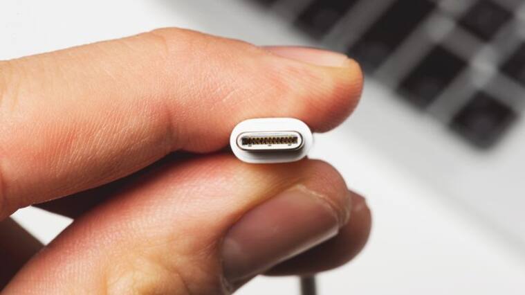 Close up shot of usb c cable by holding it.