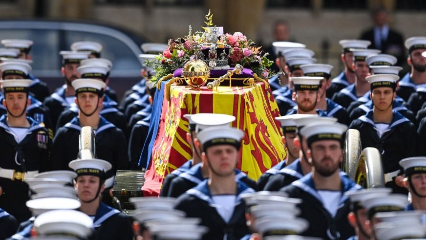 LONDON, ENGLAND - SEPTEMBER 19: The Royal Navy carry the coffin of Queen Elizabeth II on a State Gun Carriage in the procession after the State funeral at Westminster Abbey on September 19, 2022 in London, England. Elizabeth Alexandra Mary Windsor was born in Bruton Street, Mayfair, London on 21 April 1926. She married Prince Philip in 1947 and ascended the throne of the United Kingdom and Commonwealth on 6 February 1952 after the death of her Father, King George VI. Queen Elizabeth II died at Balmoral Castle in Scotland on September 8, 2022, and is succeeded by her eldest son, King Charles III. (Photo by Marc Aspland - WPA Pool/Getty Images)