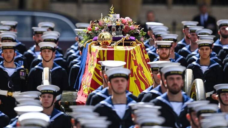 LONDON, ENGLAND - SEPTEMBER 19: The Royal Navy carry the coffin of Queen Elizabeth II on a State Gun Carriage in the procession after the State funeral at Westminster Abbey on September 19, 2022 in London, England. Elizabeth Alexandra Mary Windsor was born in Bruton Street, Mayfair, London on 21 April 1926. She married Prince Philip in 1947 and ascended the throne of the United Kingdom and Commonwealth on 6 February 1952 after the death of her Father, King George VI. Queen Elizabeth II died at Balmoral Castle in Scotland on September 8, 2022, and is succeeded by her eldest son, King Charles III. (Photo by Marc Aspland - WPA Pool/Getty Images)