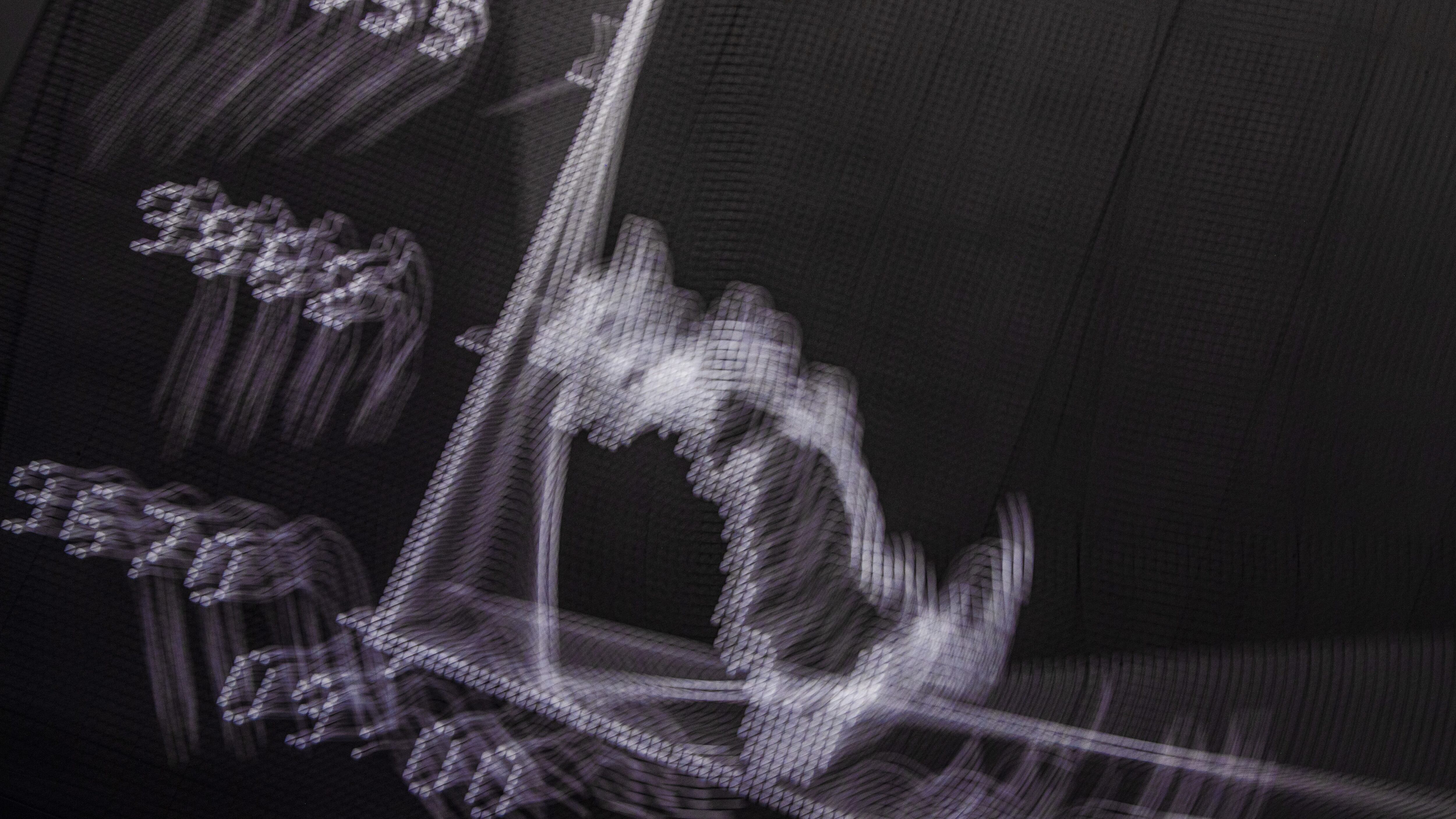 12 March 2020, Hessen, Frankfurt/Main: The curve of the DAX on the display board in the trading room of the Frankfurt Stock Exchange (shot with camera movement during exposure). At the start of trading, the Deutsche Aktien Index (DAX) had fallen below the 10,000 point mark for the first time since 2016. Photo: Boris Roessler/dpa (Photo by Boris Roessler/picture alliance via Getty Images)
