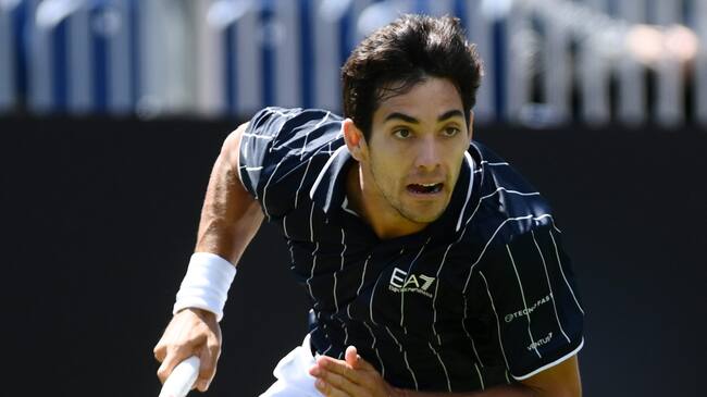 EASTBOURNE, ENGLAND - JUNE 20: Cristian Garin of Chile in action against Alex de Minaur of Australia during the Men's Single's First Round match uring Day Three of Rothesay International Eastbourne at Devonshire Park on June 20, 2022 in Eastbourne, England. (Photo by Mike Hewitt/Getty Images)