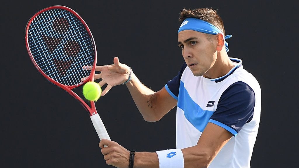 MELBOURNE, AUSTRALIA - JANUARY 23: Alejandro Tabilo of Chile plays a backhand during his Men's Singles second round match against John Isner of the United States on day four of the 2020 Australian Open at Melbourne Park on January 23, 2020 in Melbourne, Australia. (Photo by Jaimi Chisholm/Getty Images)