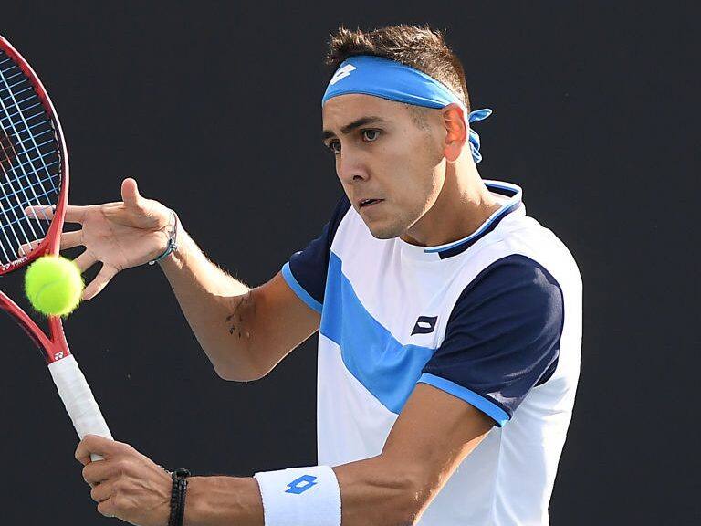 MELBOURNE, AUSTRALIA - JANUARY 23: Alejandro Tabilo of Chile plays a backhand during his Men's Singles second round match against John Isner of the United States on day four of the 2020 Australian Open at Melbourne Park on January 23, 2020 in Melbourne, Australia. (Photo by Jaimi Chisholm/Getty Images)