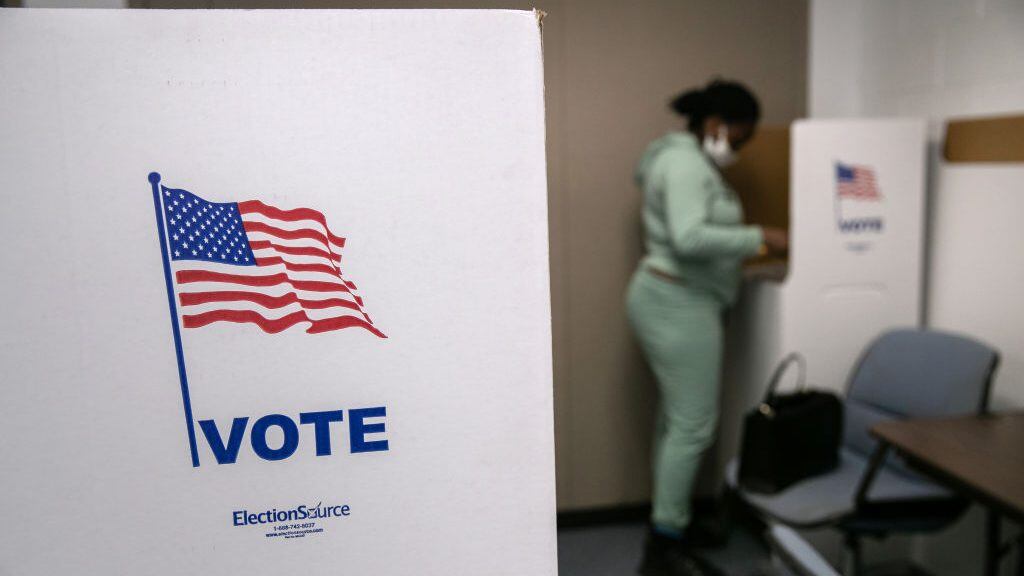 LANSING, MICHIGAN - NOVEMBER 02: A voter fills out her ballot on the last day of early voting at the Lansing City Clerk's office on November 02, 2020 in Lansing, Michigan. In 2016 U.S. President Donald Trump narrowly won Michigan, which is now a main battleground state. (Photo by John Moore/Getty Images)