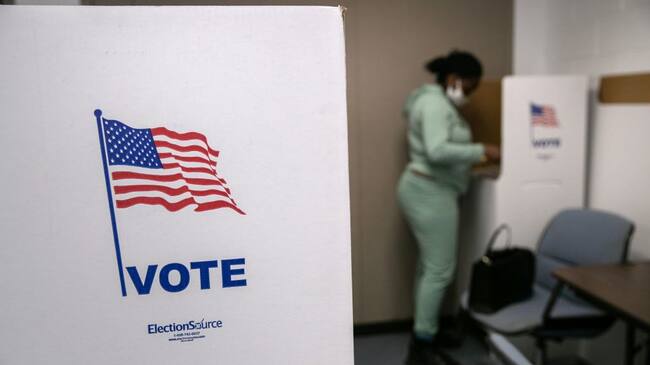 LANSING, MICHIGAN - NOVEMBER 02: A voter fills out her ballot on the last day of early voting at the Lansing City Clerk's office on November 02, 2020 in Lansing, Michigan. In 2016 U.S. President Donald Trump narrowly won Michigan, which is now a main battleground state. (Photo by John Moore/Getty Images)