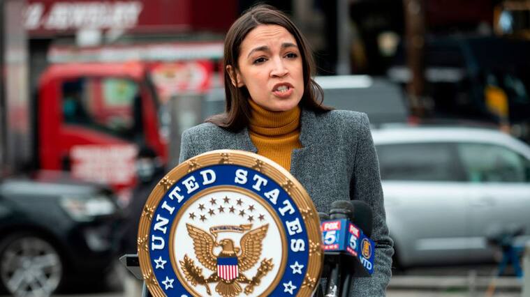 Democratic Congresswoman from New York Alexandria Ocasio-Cortez speaks during a press conference in the Corona neighbourhood of Queens on April 14, 2020 in New York City. - Senate Minority Leader Chuck Schumer and Democratic Rep. Alexandria Ocasio-Cortez hold a press conference amid the coronavirus pandemic to call on the Federal Emergency Management Administration (FEMA) to begin approving disaster funds to help families in lower-income communities and communities of color pay for funeral costs. (Photo by Johannes EISELE / AFP) (Photo by JOHANNES EISELE/AFP via Getty Images)