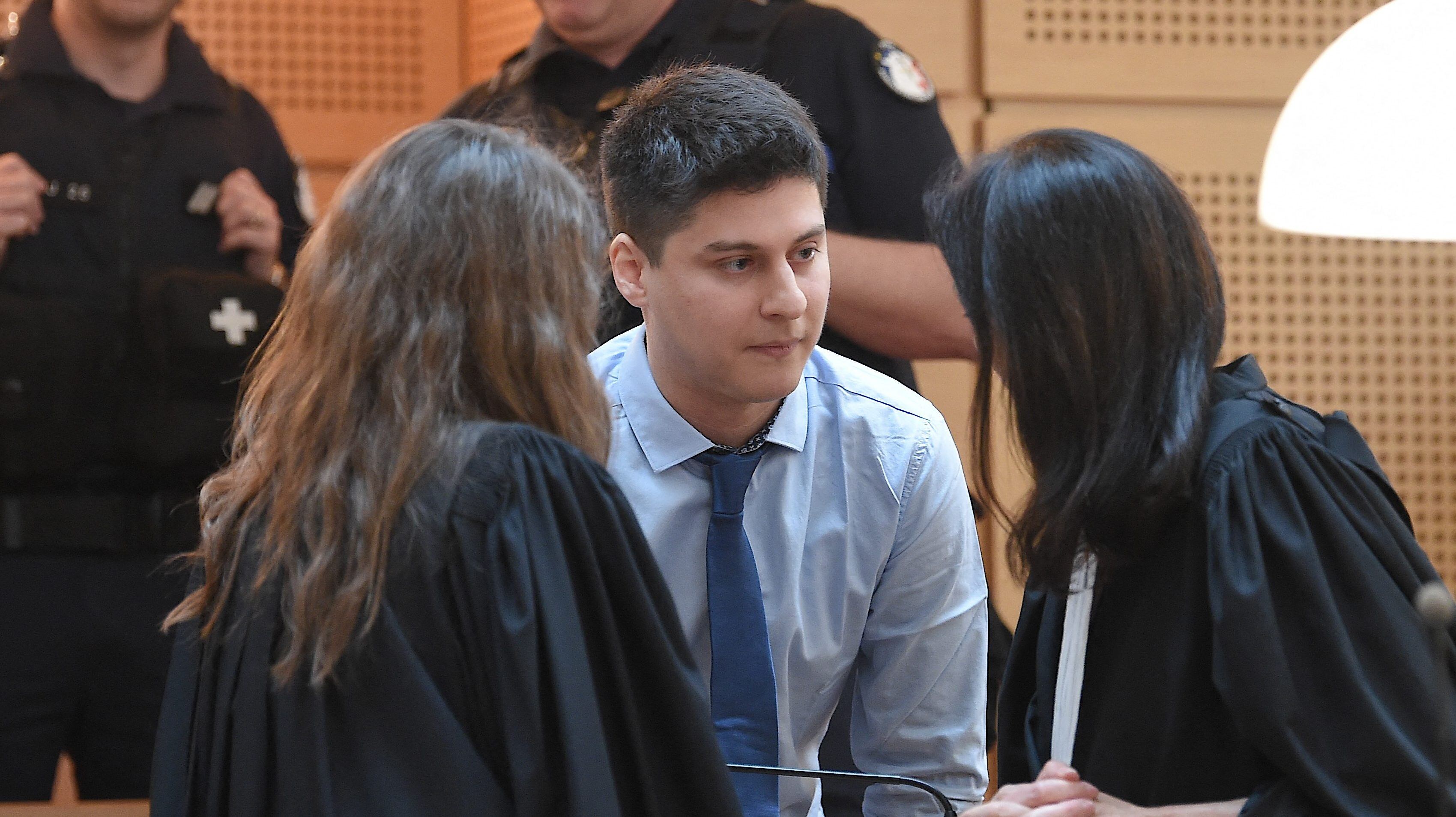 Defendant Chilean national Nicolas Zepeda (C), speaks with his lawyers Jacqueline Laffont (R) and Julie Benedetti (L), on the first day of his trial in which he is accused of murdering his Japanese ex-girlfriend in France in 2016, at the courthouse of Besancon, on March 29, 2022. - Zepeda goes on trial in France on March 29 accused of the murder of his Japanese ex-girlfriend, Narumi Kurosaki, who disappeared in 2016 in a high-profile case that has gripped three continents. The trial of Nicolas Zepeda, who denies killing Kurosaki, is going ahead after he was extradited from his country to France in 2020. (Photo by PATRICK HERTZOG / AFP) (Photo by PATRICK HERTZOG/AFP via Getty Images)