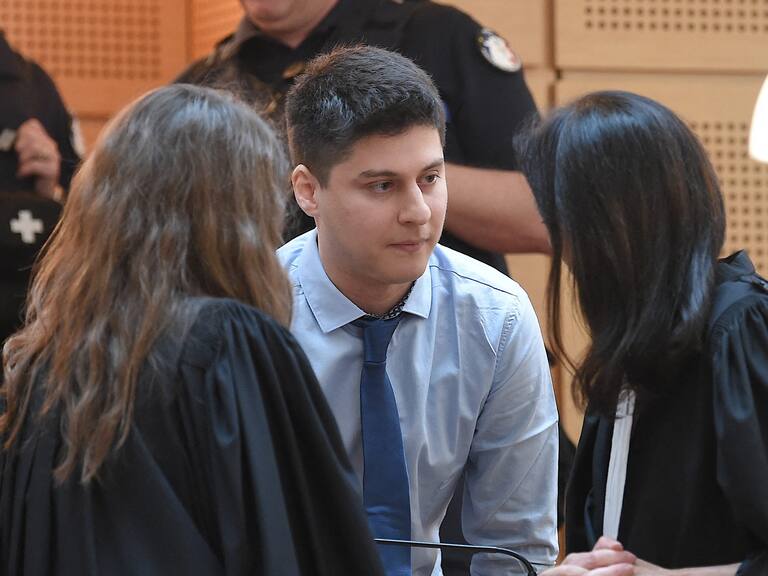 Defendant Chilean national Nicolas Zepeda (C), speaks with his lawyers Jacqueline Laffont (R) and Julie Benedetti (L), on the first day of his trial in which he is accused of murdering his Japanese ex-girlfriend in France in 2016, at the courthouse of Besancon, on March 29, 2022. - Zepeda goes on trial in France on March 29 accused of the murder of his Japanese ex-girlfriend, Narumi Kurosaki, who disappeared in 2016 in a high-profile case that has gripped three continents. The trial of Nicolas Zepeda, who denies killing Kurosaki, is going ahead after he was extradited from his country to France in 2020. (Photo by PATRICK HERTZOG / AFP) (Photo by PATRICK HERTZOG/AFP via Getty Images)