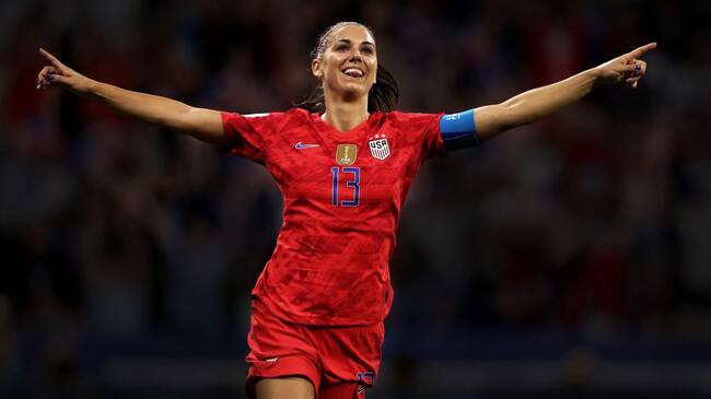 LYON, FRANCE - JULY 02: (EDITORS NOTE - This image has been digitally filtered) Alex Morgan of the USA celebrates her sides second goal during the 2019 FIFA Women's World Cup France Semi Final match between England and USA at Stade de Lyon on July 02, 2019 in Lyon, France. (Photo by Naomi Baker - FIFA/FIFA via Getty Images)