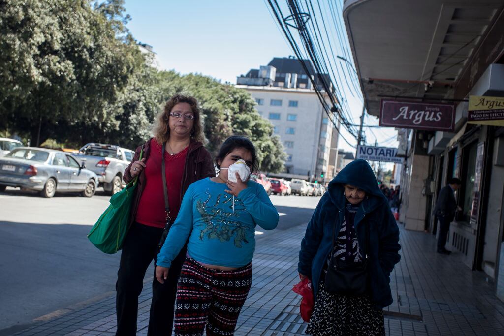 People wearing a face mask as preventive measure in Osorno, Chile, on March 19, 2020. Citizens gradually begin to become aware of the danger of the covid-19. After a state of catastrophe has been decreed in all of Chile for ninety days, the evils have been closed, schools and the military have taken to the streets, despite everything, most people with less economic resources have to continue working with the minimum measures. of security in Osorno, Chile. (Photo by Fernando Lavoz/NurPhoto via Getty Images)