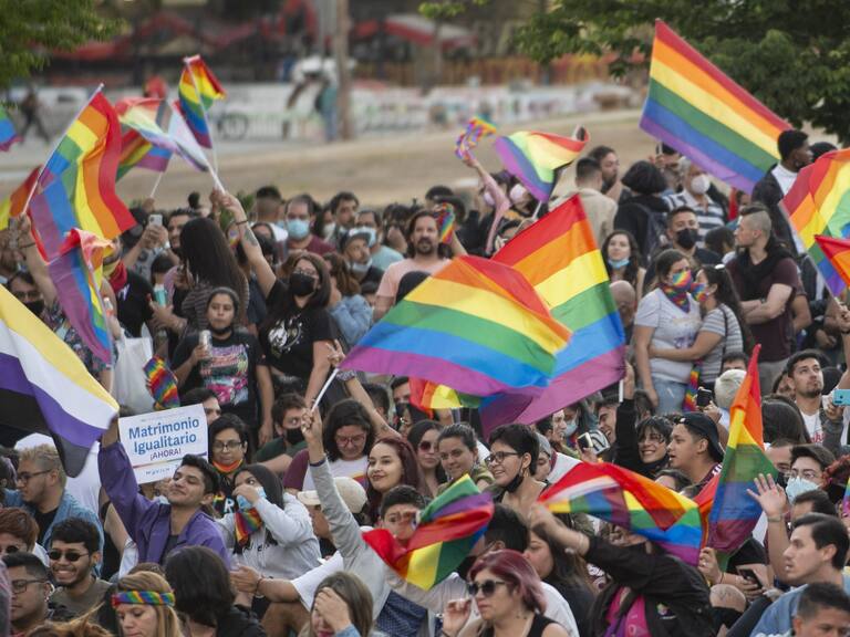 SANTIAGO, CHILE - DECEMBER 07: People celebrate waving rainbow flags during a rally after the bill for same-sex marriage was approved by the Chilean senate on December 7, 2021 in Santiago, Chile. Chile, which legalized same-sex civil unions in 2015, has been discussing gay marriage since 2017. (Photo by Claudio Santana/Getty Images)