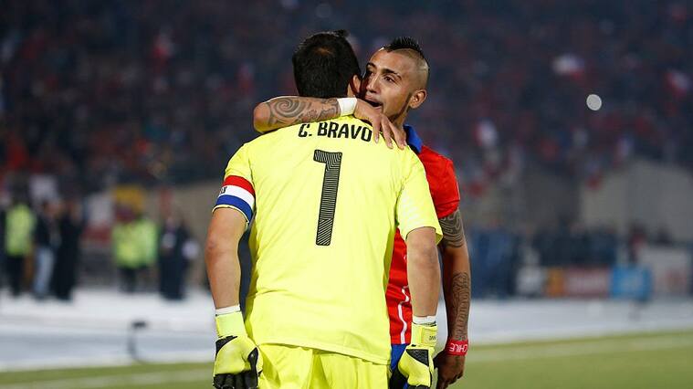 SANTIAGO, CHILE - JULY 04: Claudio Bravo of Chile celebrates with teammate Arturo Vidal after winning the 2015 Copa America Chile Final match between Chile and Argentina at Nacional Stadium on July 04, 2015 in Santiago, Chile. (Photo by Gabriel Rossi/LatinContent via Getty Images)