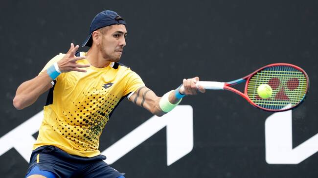MELBOURNE, AUSTRALIA - JANUARY 17: Alejandro Tabilo of Chile plays a forehand in his first round singles match against Carlos Alcaraz of Spain during day one of the 2022 Australian Open at Melbourne Park on January 17, 2022 in Melbourne, Australia. (Photo by Mackenzie Sweetnam/Getty Images)