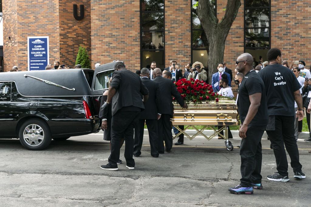 MINNEAPOLIS, USA - JUNE 04: George Floyd's casket is wheeled to a hearse after the first of three memorial services for him on June 4, 2020 at Trask Worship Center at North Central University in Minneapolis, Minnesota, United States. Hundreds of mourners Thursday attended the first of several memorials for George Floyd â an unarmed, handcuffed black man who was killed in police custody late last month. The service at North Central University in Minneapolis, Minnesota, was attended by Floyd's family and Ben Crump, the civil rights attorney representing the family, and celebrity guests. (Photo by Jordan Strowder/Anadolu Agency via Getty Images)