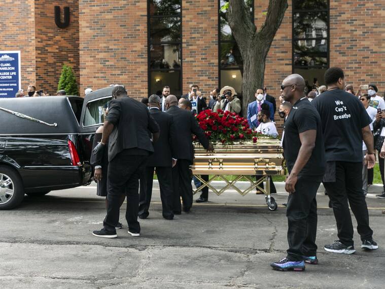 MINNEAPOLIS, USA - JUNE 04: George Floyd's casket is wheeled to a hearse after the first of three memorial services for him on June 4, 2020 at Trask Worship Center at North Central University in Minneapolis, Minnesota, United States. Hundreds of mourners Thursday attended the first of several memorials for George Floyd â an unarmed, handcuffed black man who was killed in police custody late last month. The service at North Central University in Minneapolis, Minnesota, was attended by Floyd's family and Ben Crump, the civil rights attorney representing the family, and celebrity guests. (Photo by Jordan Strowder/Anadolu Agency via Getty Images)